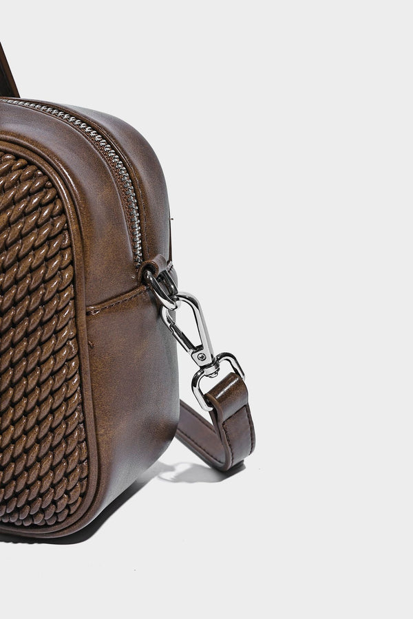 Structured woven-texture front top-handle handbag with zip closure, dual handles, detachable shoulder strap, and matching