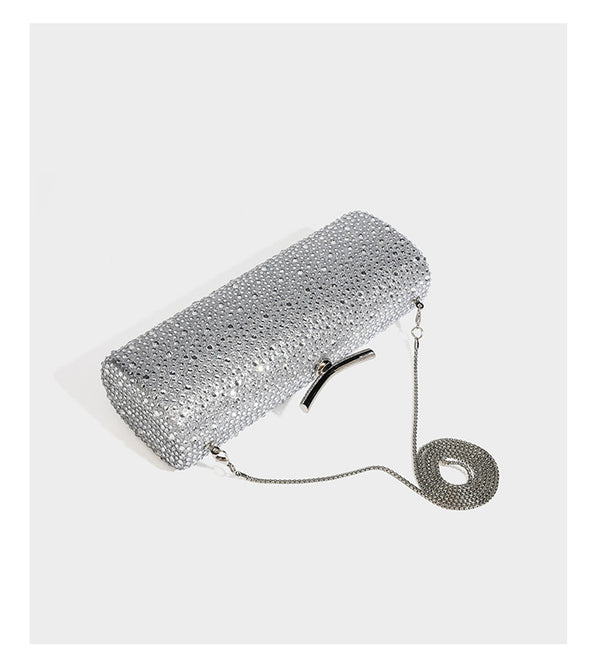 Structured rectangular hard-case clutch bag covered in all-over rhinestone crystal embellishment with curved kiss-lock top