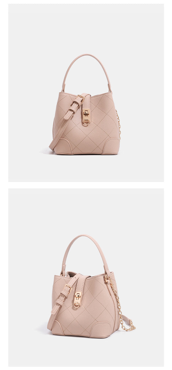 Mini diamond-quilted pebbled-finish bucket bag with gold-tone turn-lock closure and top handle, detail view 10