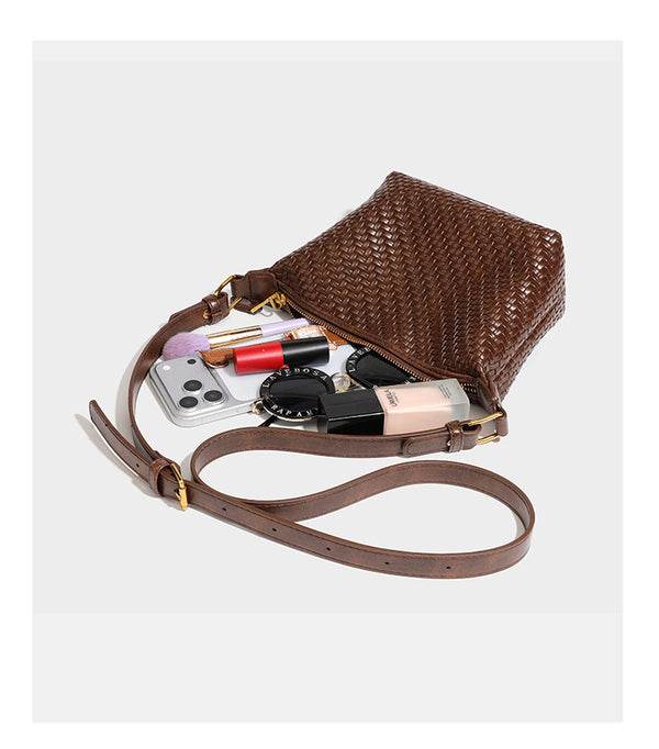 Small glossy basket-weave hobo shoulder bag in brown with knotted top handle, flap accent pocket, and gold-tone hardware