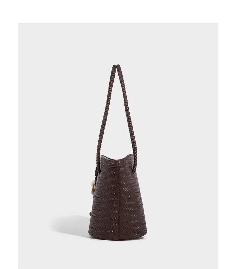 Chevron-woven bucket tote bag with braided shoulder straps and matching drawstring pouch, detail view 18
