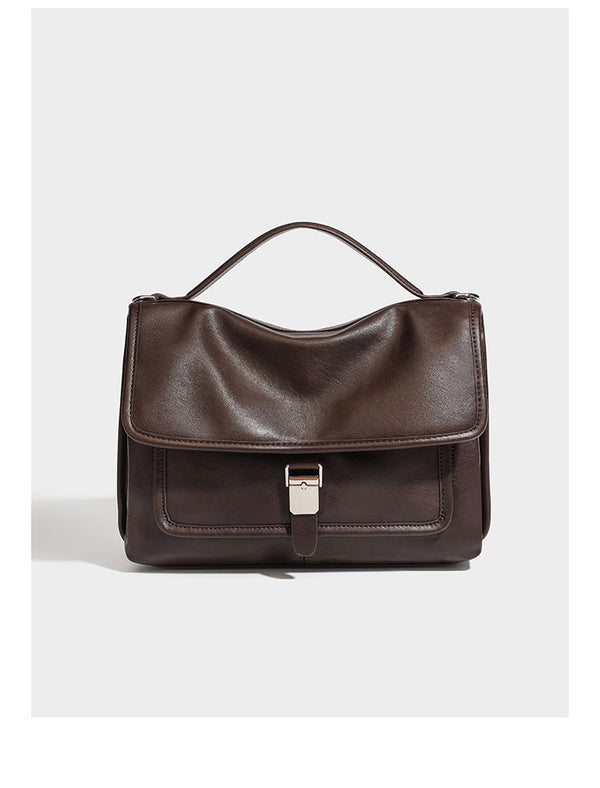 Structured rectangular flap satchel in espresso brown leather-look finish with silver-tone turn-lock buckle, top handle, and