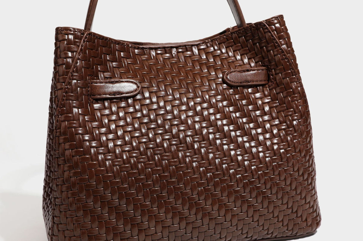 Structured woven leather-look bucket bag with gold-tone turn-lock hardware and detachable shoulder strap, detail view 36