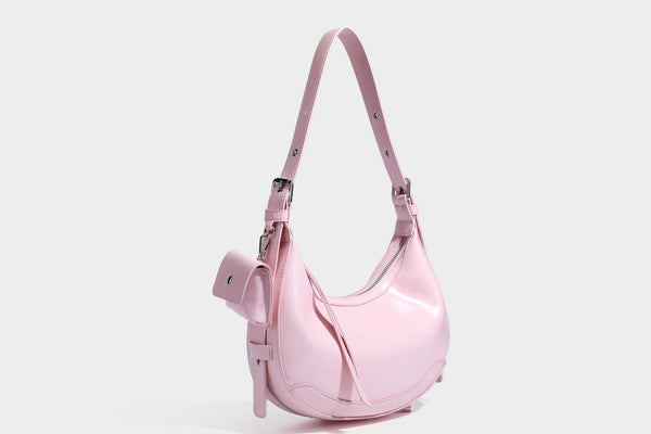 Glossy leather-look crescent hobo shoulder bag with dark contrast trim, silver-tone hardware, and attached mini flap pouch