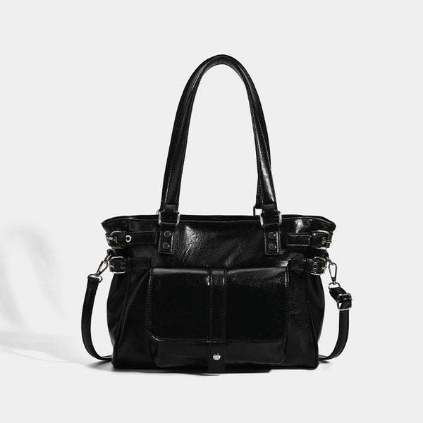 Large glossy leather-look tote bag with front flap pocket, silver-tone buckle hardware, dual top handles and detachable