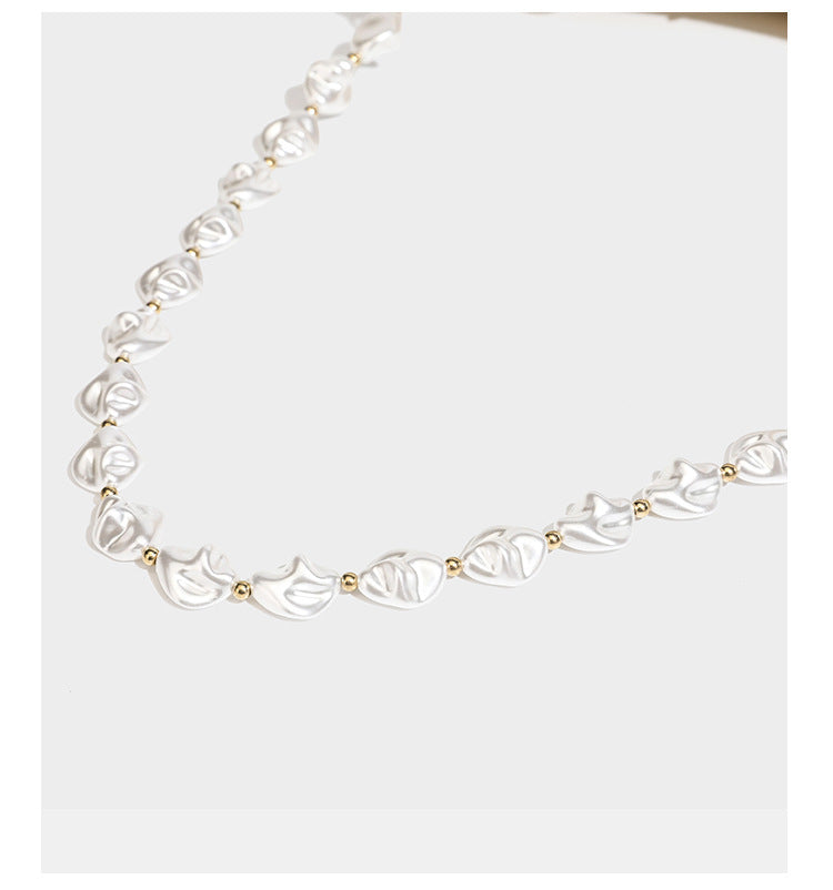 Champagne and ivory large-disc sequin shoulder bag with baroque faux-pearl beaded chain strap and silver-tone zip closure