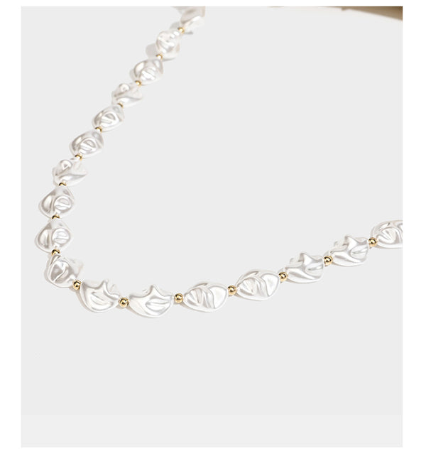 Champagne and ivory large-disc sequin shoulder bag with baroque faux-pearl beaded chain strap and silver-tone zip closure