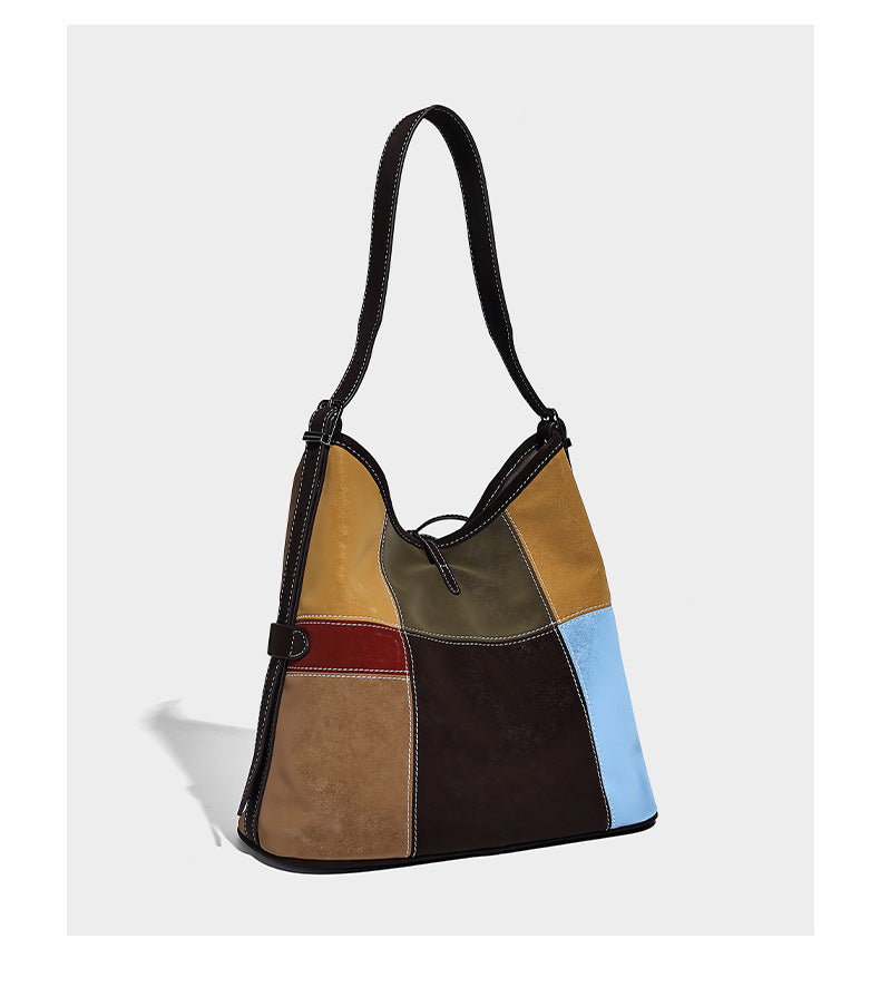 Patchwork bucket tote shoulder bag with tan, dark brown, olive, red, and sky blue color-block panels, white contrast, detail