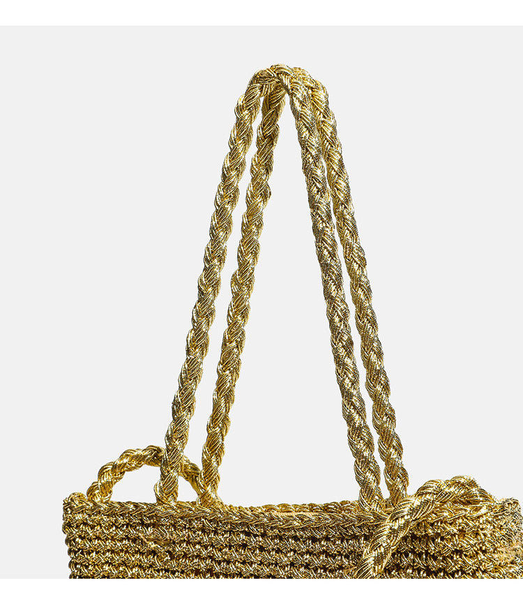 Small soft rectangular metallic crochet-weave shoulder bag with braided top handle and long crossbody strap, detail view 12