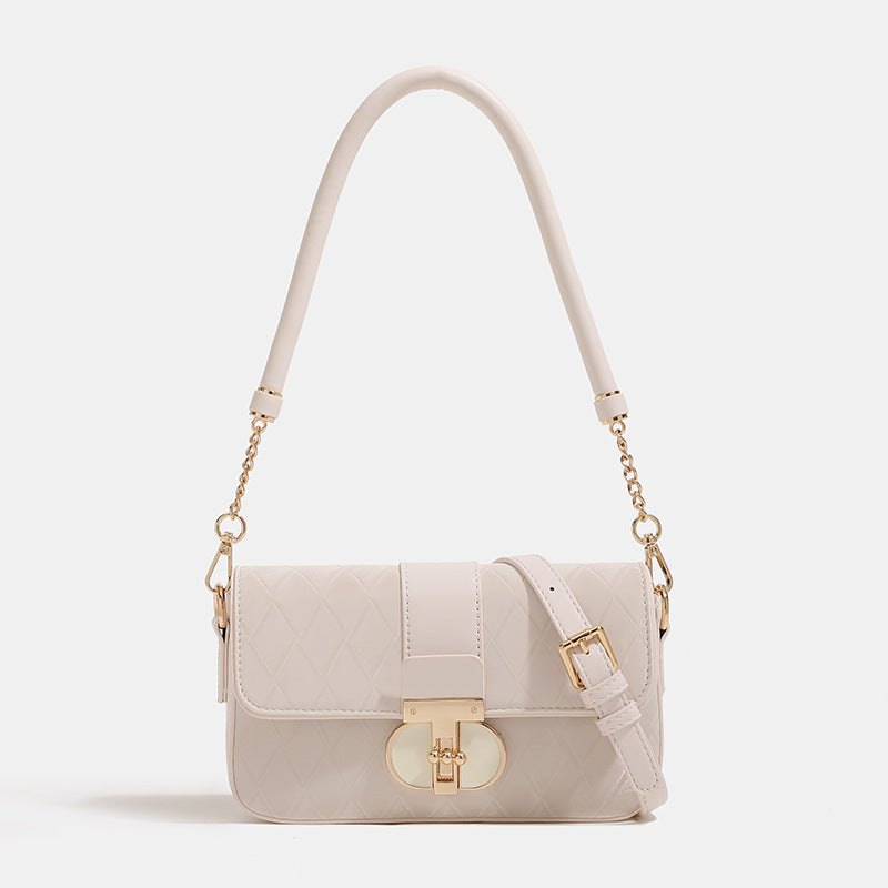 Compact quilted flap crossbody bag with gold turn-lock clasp and adjustable shoulder strap, detail view 6