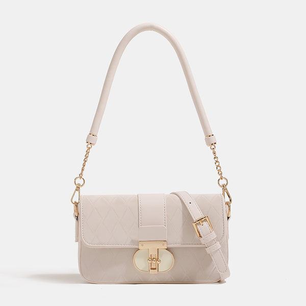 Compact quilted flap crossbody bag with gold turn-lock clasp and adjustable shoulder strap, detail view 6