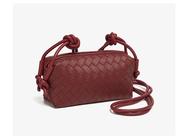 Small rectangular woven-texture mini crossbody bag with knotted rope strap and gold-tone zip closure, detail view 17
