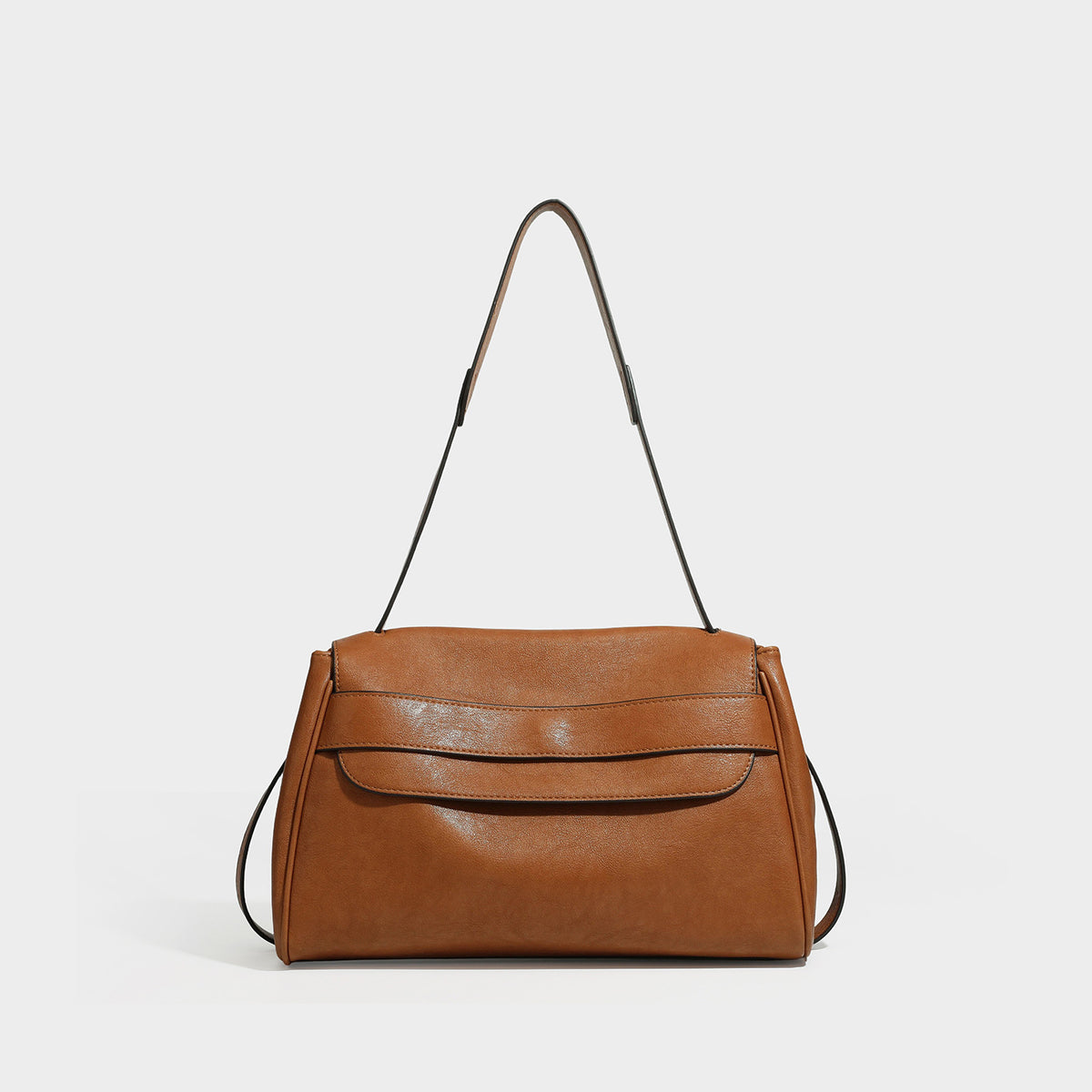 Structured rectangular flap shoulder bag in dark brown leather-look finish with long single strap and layered front panel