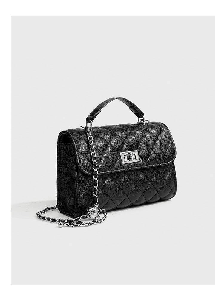 Small structured diamond-quilted flap satchel bag with silver-tone chain strap and turn-lock closure, detail view 17