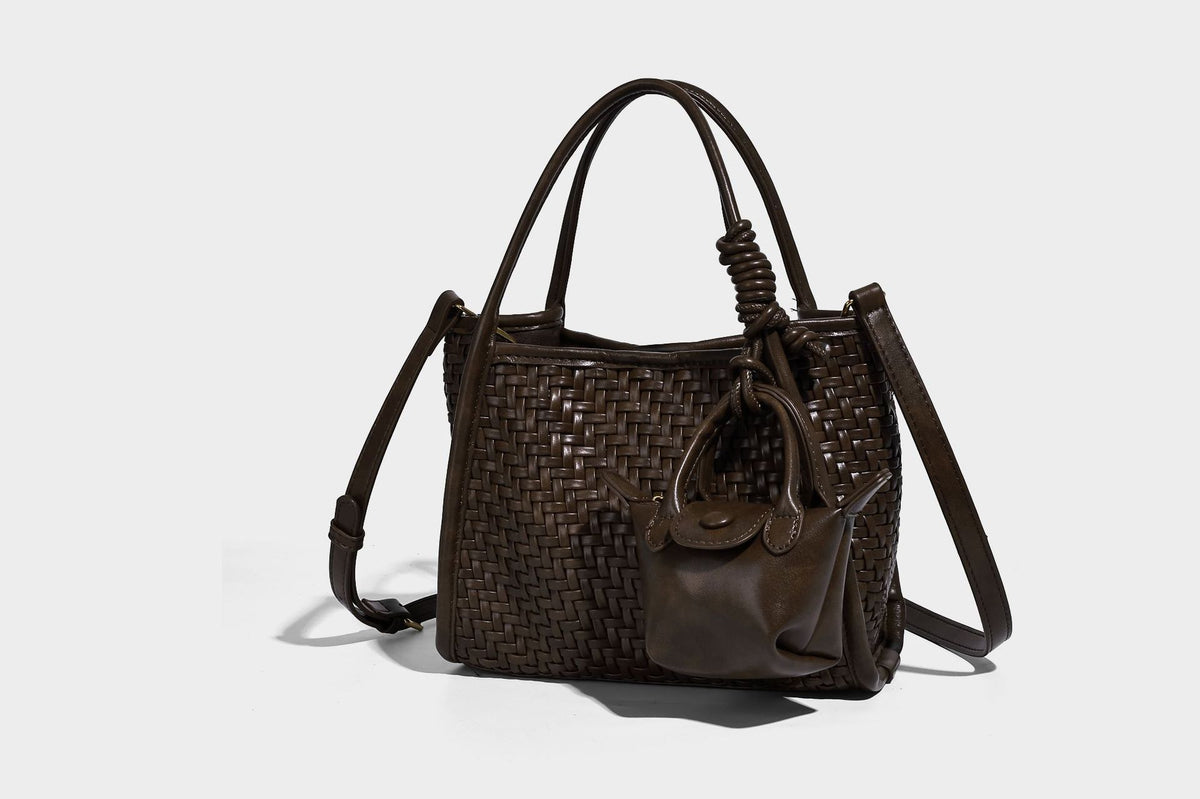 Woven texture open-top tote bag with smooth trim top handles and attached mini drawstring pouch in dark brown, detail view 16