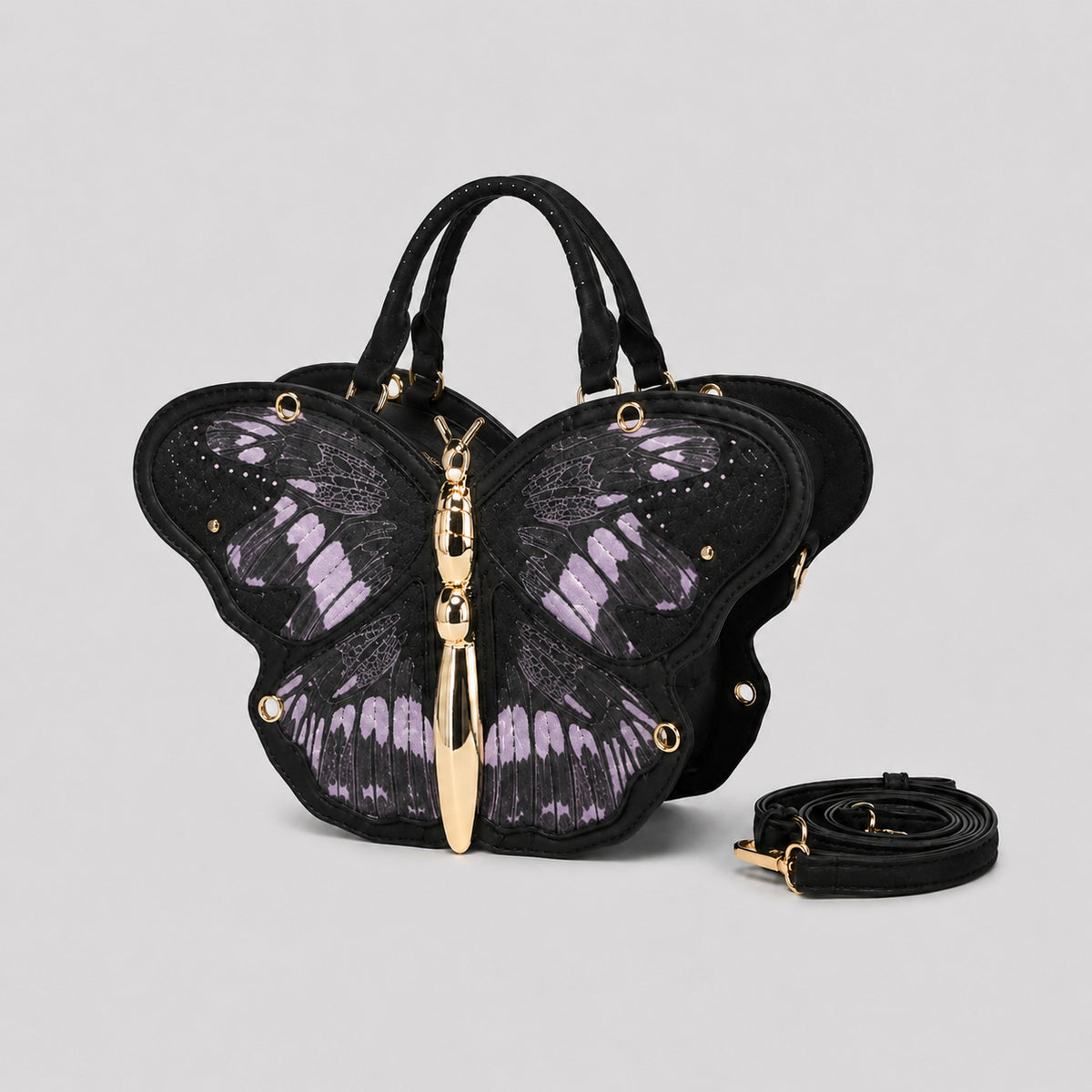 Schwarze Handtasche in Schmetterlingsform mit rosafarbenem Print auf den Flügelpartien und goldfarbenem, skulpturalem Reißverschlussanhänger in Form eines Schmetterlingskörpers, Detailansicht 8