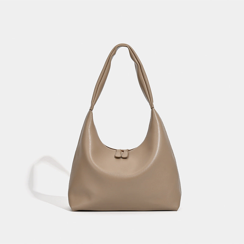 Smooth leather-look slouchy hobo shoulder bag with zip closure and wide single strap, front view