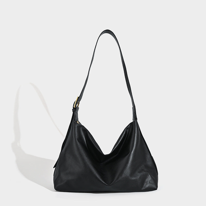 Large slouchy hobo shoulder bag in smooth black leather-look finish with gold-tone buckle hardware and adjustable strap