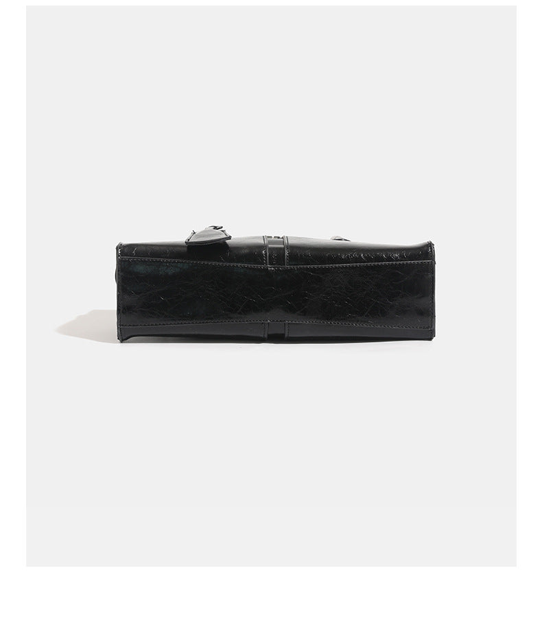 Structured glossy leather-look tote bag with long loop handles and silver turn-lock buckle closure, detail view 14