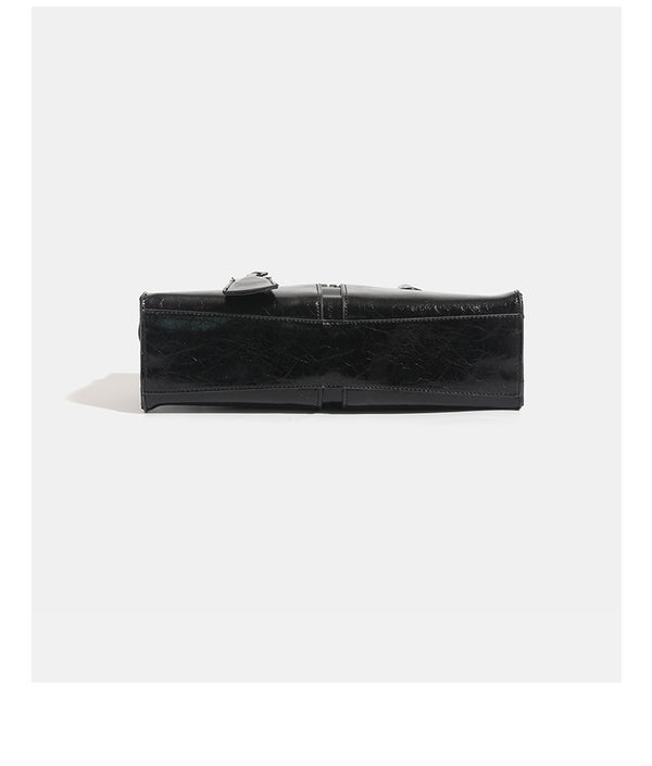 Structured glossy leather-look tote bag with long loop handles and silver turn-lock buckle closure, detail view 14