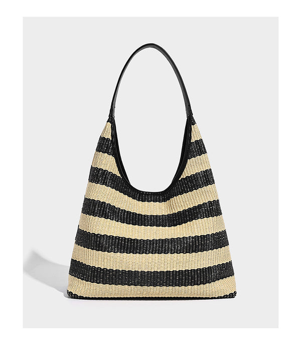 Black and beige striped woven shoulder tote bag with leather-look trim and detachable black zip pouch, detail view 9