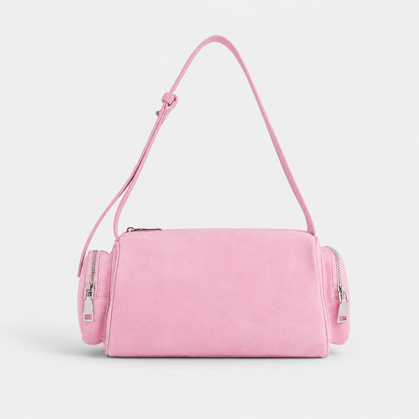 Mini barrel shoulder bag with side zip pouches and adjustable strap in pink suede-like finish, detail view 2