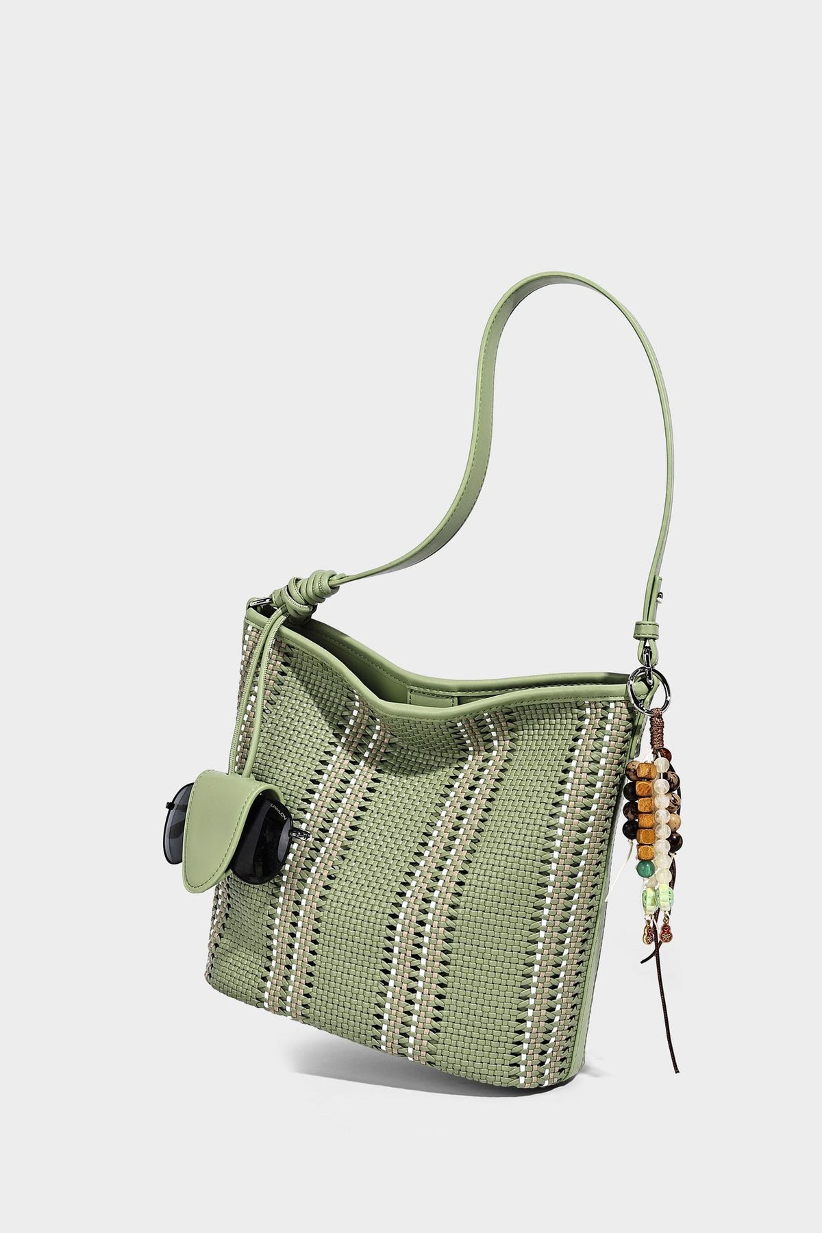 Woven bucket shoulder bag with leather-look trim, silver-tone hardware, and beaded tassel charm, detail view 22