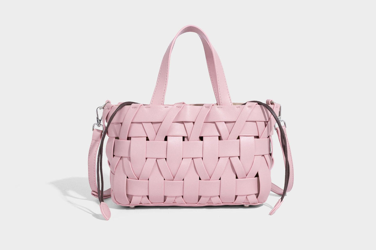 Structured woven basket tote handbag with contrasting dark trim, double top handles, detachable shoulder strap, and