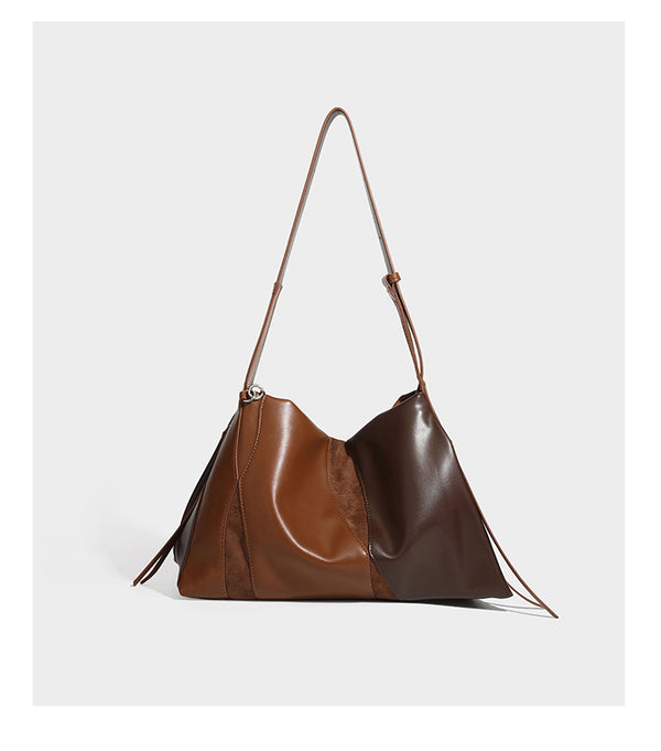 Two-tone black and brown leather-look slouchy shoulder bag with beaded tassel charm and silver-tone hardware, detail view 15