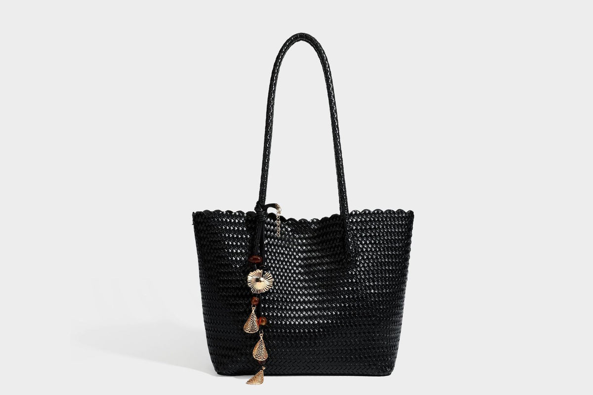 Large open-top woven leather-look tote bag in dark brown with scalloped edge, braided double shoulder straps, and decorative