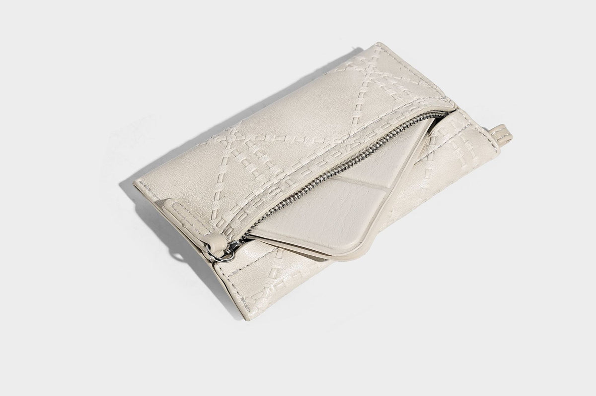 Quilted diamond-pattern tote bag with attached front zip pouch and long shoulder straps, detail view 26