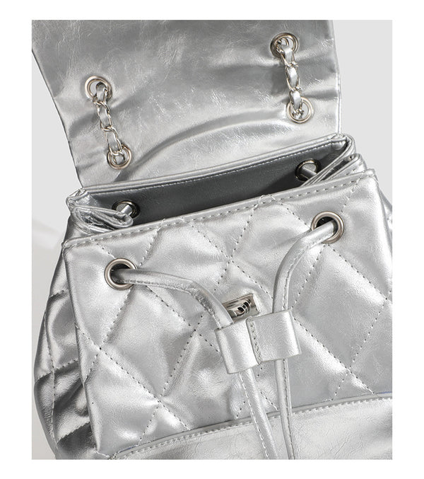 Quilted leather-look backpack with heart turn-lock clasp and woven chain handles, detail view 11