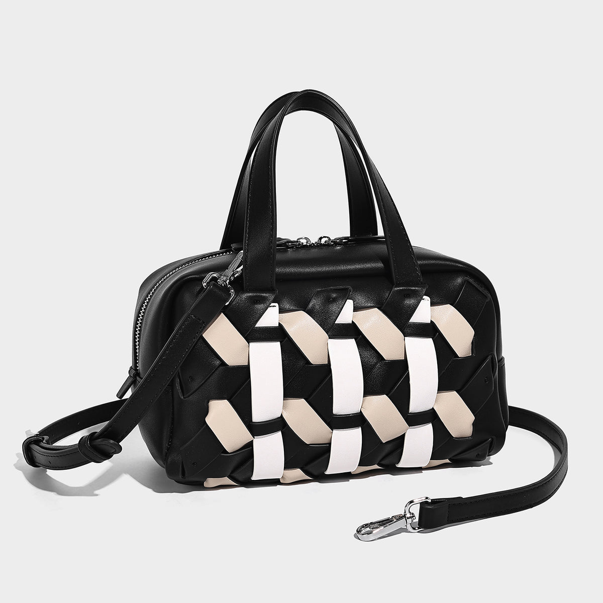 Small structured satchel bag with two-tone woven front panel, dual top handles, and detachable crossbody strap in tan brown