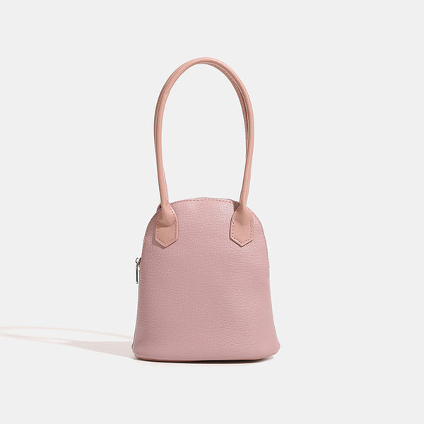 Rounded shell handbag with pebbled leather-look finish, dual top handles, and silver-tone zipper, detail view 6