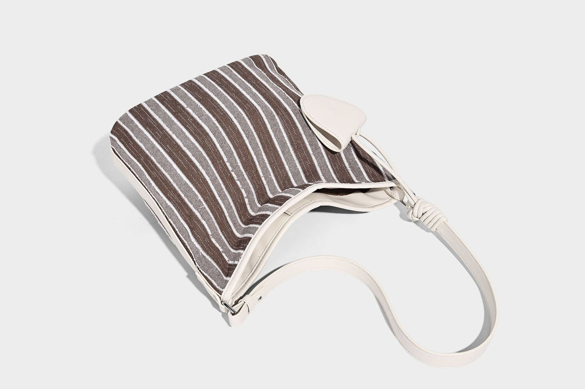 Large striped canvas hobo shoulder bag with cream trim and silver-tone hardware, detail view 16