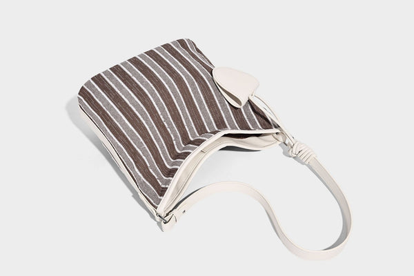 Large striped canvas hobo shoulder bag with cream trim and silver-tone hardware, detail view 16