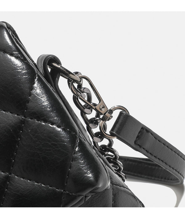 Quilted diamond-stitch flap crossbody bag with gunmetal chain strap and cut-out bar handle, detail view 18
