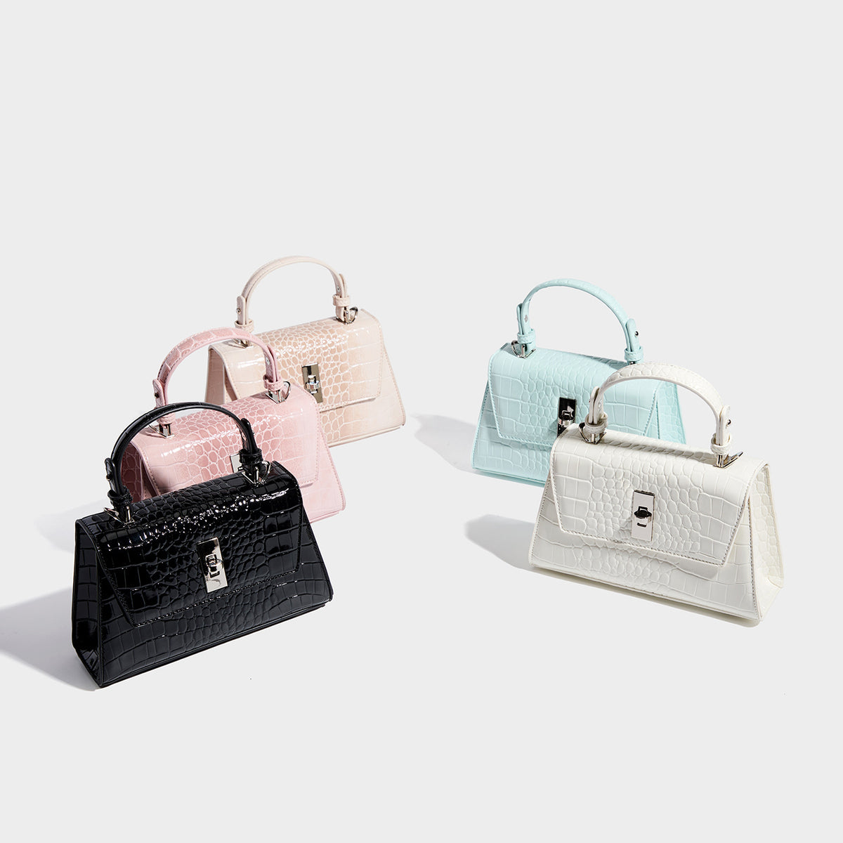 Small structured crocodile-embossed glossy top-handle satchel bag with silver-tone turn-lock clasp and detachable shoulder