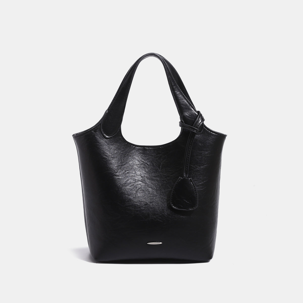 Soft glossy leather-look bucket tote bag with twin handles and detachable crossbody strap, detail view 8