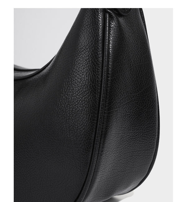 Crescent half-moon shoulder bag in pebbled leather-look finish with adjustable strap and silver-tone hardware, detail view 14