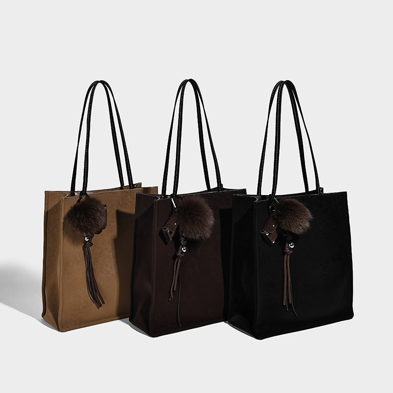 Tall rectangular matte suede-look tote bag with dual shoulder straps and matching zip pouch, detail view 2