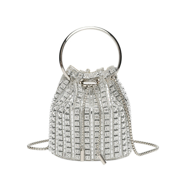 Mini crystal rhinestone bucket bag with circular ring top handle, drawstring closure, and silver chain shoulder strap, detail