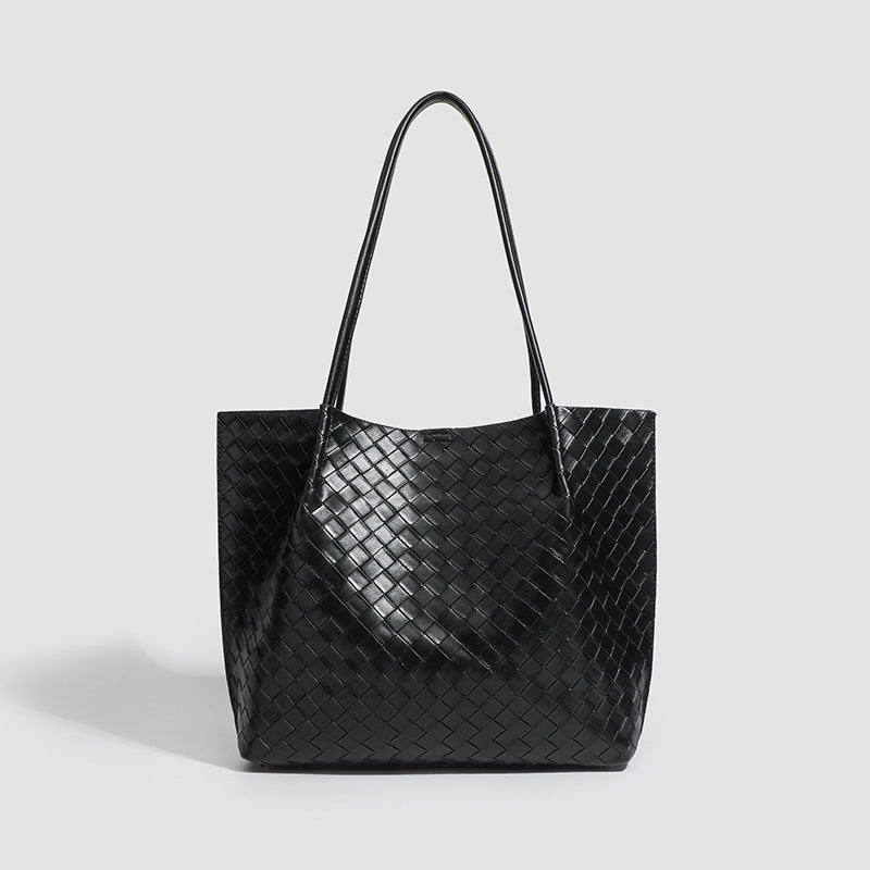 Large black woven leather-look tote bag with twin shoulder straps and matching inner pouch, front view