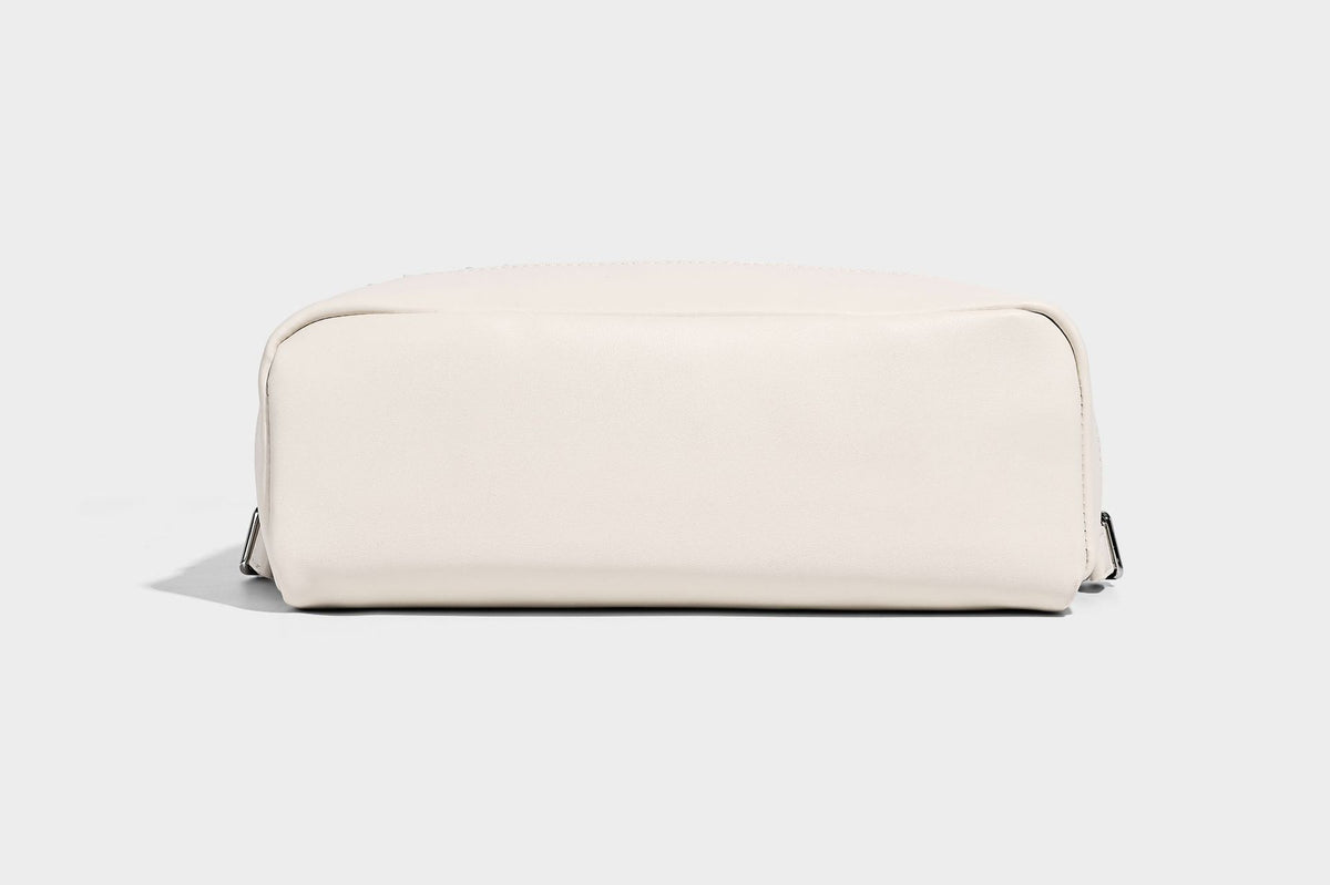 Small structured striped fabric backpack handbag with cream leather-look trim, top handle, and silver-tone hardware, detail