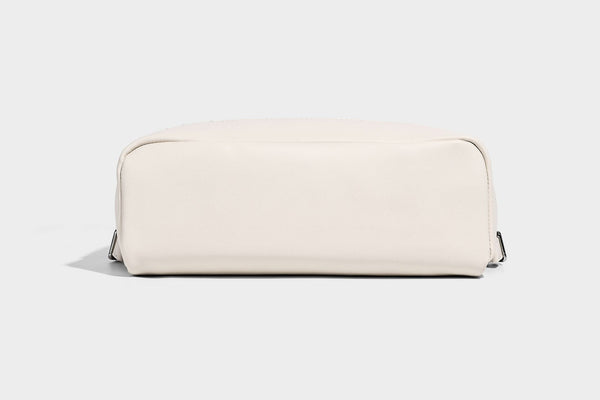 Small structured striped fabric backpack handbag with cream leather-look trim, top handle, and silver-tone hardware, detail