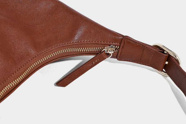 Glossy leather-look slouchy hobo shoulder bag with zip closure, gold-tone hardware, and adjustable strap, detail view 22