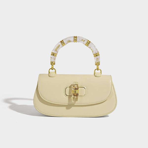 Kleine strukturierte Satteltasche mit durchscheinendem rosafarbenem Henkel aus Kunstharz im Bambus-Stil, passendem vorderem Drehverschluss, goldfarben