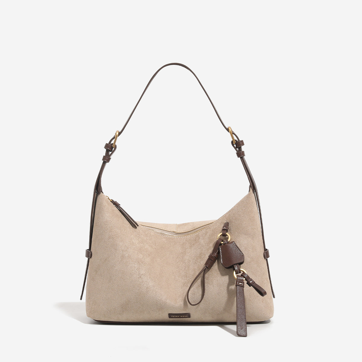 Sand beige slouchy hobo shoulder bag with dark brown trim, adjustable strap, gold-tone hardware, and decorative charm