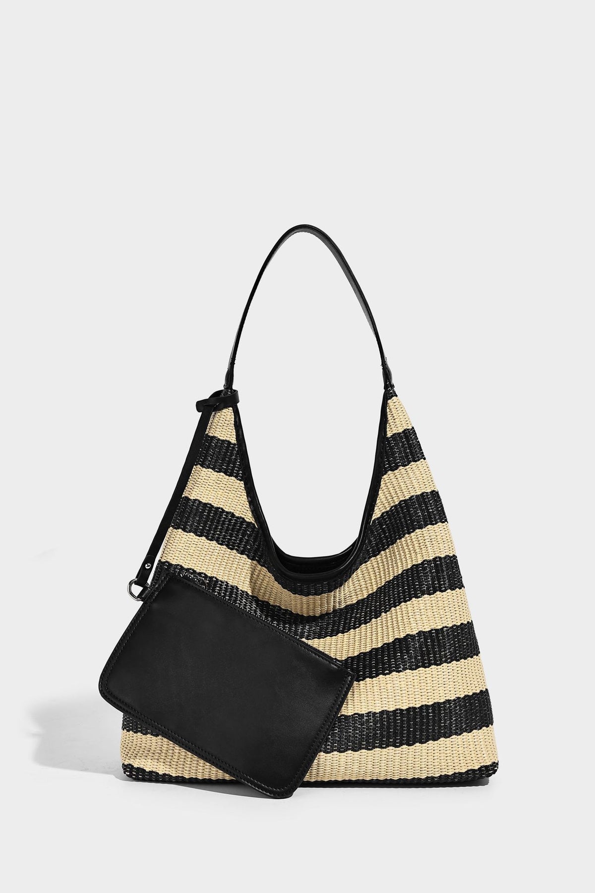 Black and beige striped woven shoulder tote bag with leather-look trim and detachable black zip pouch, detail view 11