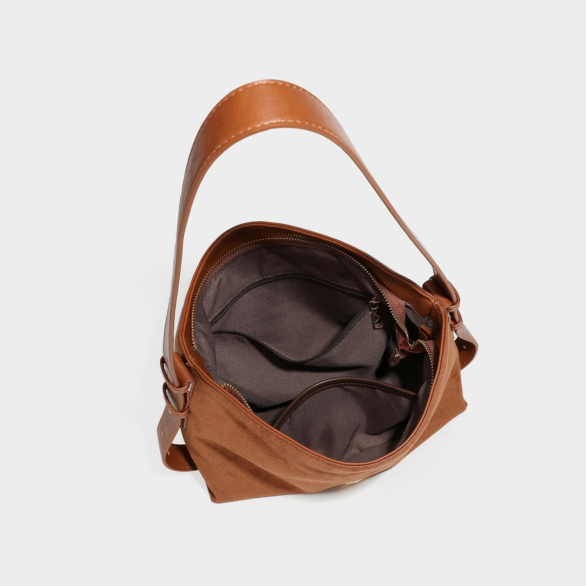 Slouchy suede-finish brown shoulder bag with long single strap and small gold-tone logo emblem on front, detail view 49